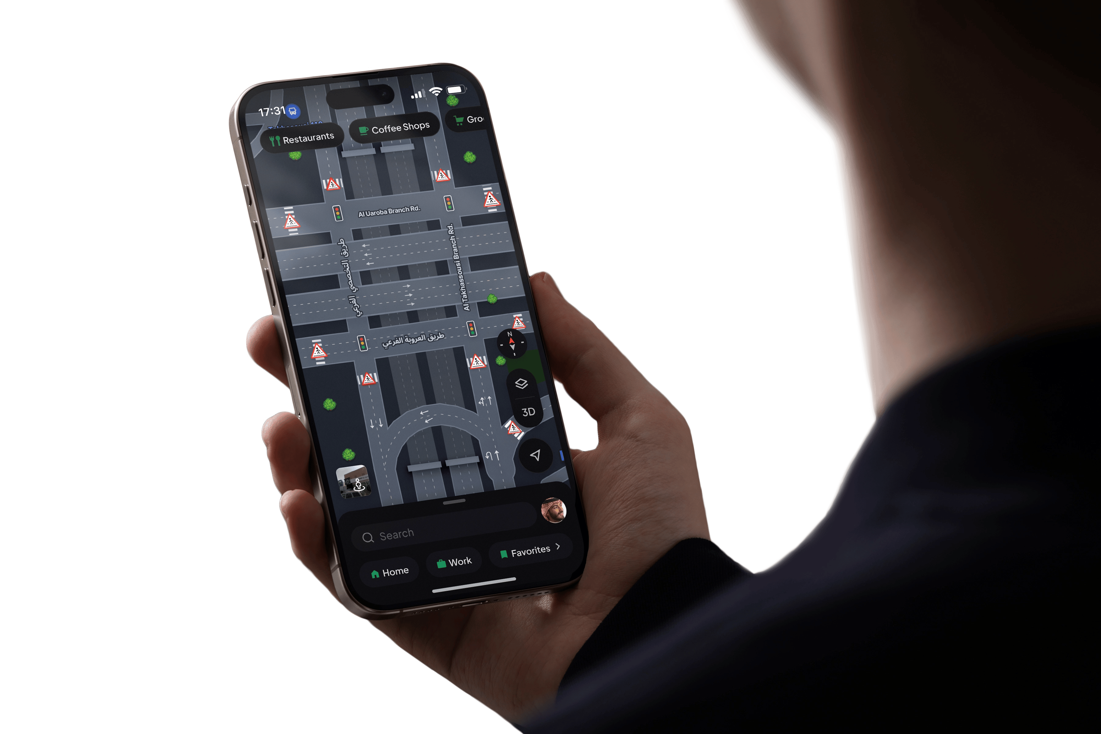 Person holding phone with Hudhud Maps app